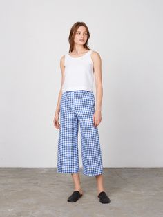 "RILEY is a wide leg cropped linen culottes. DETAILS - Cropped length - Seam pockets - Wide leg - Elasticated waist - 100% lightweight European linen fabric - Cut and sewn to order just for you in our studio COLOR - Blue Gingham, you can also choose other colors above - Fabric samples are available here https://www.etsy.com/listing/586569696/linen-fabric-samples SIZING & FIT - Fits true to size - Model is 5'10\" / 178cm and wearing a size XS CARE FOR LINEN - Machine wash up to 30ºC/86ºF gentle c Spring Cotton Cropped Leg Culottes, Spring Cotton Culottes With Cropped Leg, Summer Straight Leg Cotton Culottes, Summer Cotton Culottes With Straight Leg, Straight Leg Cotton Culottes For Summer, Summer Cropped Wide Leg Pants With Pockets, Summer Wide Leg Cropped Pants With Pockets, Wide Leg Linen Bottoms For Spring, Cropped Summer Bottoms For Daywear