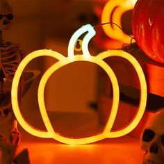 a glowing pumpkin sitting on top of a table