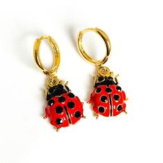 "Bright 3D ladybird earrings with a secure latch back fastening. * 18k gold plated hoops * Enamel & 18k gold plated ladybug charm * Latch back fastening for security * Approximate drop is 1.25\" (30mm) * Hoops measure 0.5\" (12mm) in diameter * Lightweight and easy to wear  * Beautifully packaged with additional gift wrap available at the checkout * Add a gift message and ship direct to the recipient  * A portion of the profit from these ladybird earrings will be donated to the Alzheimer's socie Small Hoop Clip-on Earrings For Gift, Small Hoop Clip-on Huggie Earrings As Gift, Clip-on Huggie Earrings For Gift, Clip-on Huggie Earrings As Gift, Clip-on Small Hoop Huggie Earrings For Gift, Adjustable Clip-on Hoop Earrings As A Gift, Small Hoop Clip-on Huggie Earrings For Gifts, Clip-on Hoop Huggie Earrings Gift, Ladybug Earrings