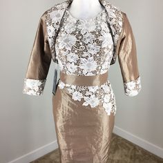 This Is New With Tags - Don't See A Size Though Brown With Cream Crochet/Lace Overlay Matching Reversible Bolero Jacket With 3/4 Sleeves - Open No Closures So Flexible With Fit Dress Is Lined - Boning In The Bodice - Hidden Zipper - Built In Bra Pads Dress Approx 36 Length Shoulder To Hem - 16 Underarm Built In Pads Make It A Littlel Hard To Measure - 27 Around Waist-17.5 Flat Across Hips Jacket Approx 15 Length Shoulder To Hem B28 Fitted White Lace Mother Of The Bride Dress, Fitted Lace White Mother Of The Bride Dress, Summer Lace Dress For Mother Of The Bride, Fitted White Mother Of The Bride Dress, White Fitted Mother Of The Bride Dress, Knee-length Spring Dress For Mother Of The Bride, Summer Midi-length Mother Of The Bride Dress, Spring Knee-length Dress For Mother Of The Bride, Fitted Midi Length Dress For Mother Of The Bride