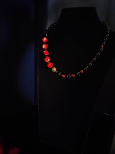 Beautiful handmade necklace with natural red coral cubes(10mm), black agate pearl beads and hematite beads. All metal components are 18K gold plated. The necklace is 47 cm long, is a crew neck and has an adjustable golden steel clasp with a 5 cm extension. The necklace is asymmetrical, very beautiful due to the contrast of the red and black colors and the shape of the beads - cubes and rounds. The necklace is very elegant, very beautiful in summer with a low-cut dress. It recalls the sea, the sun... for those who love nature. A beautiful gift for her All jewels are delivered in a decorated box, ready to be given as a gift to your loved one. How to take care of your jewellery: put on your beauty products (cosmetics, perfumes, ...) before wearing your precious jewel. Clean your jewelry with Onyx Beaded Necklace With Black Beads As A Gift, Onyx Black Beads Necklace As A Gift, Elegant Red Beaded Necklace With Black Beads, Elegant Red And Black Beaded Necklaces, Elegant Red And Black Beaded Necklace, Onyx Black Beads For Gifts, Red Necklace With Black Beads As Gift, Red Necklace With Black Beads For Gift, Red Onyx Jewelry For Gift