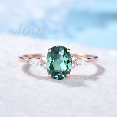 Accept engrave the words inside the ring service: https://www.etsy.com/listing/1103764936/engrave-service HOW TO STYLE : This Rose Gold Teal Sapphire Ring is the most versatile and elegant statement ring for casual days in the office and nights out. It's your go-to statement piece whatever the occasion. It also can be personalized to show your uniqueness in the party, date, banquet. AFTER-SALE SERVICE : 30 days money-back guarantee and for any reason, you are not satisfied with your purchase, please contact me and I will quickly handle your request within 24 hours. DETAILS: - Material : 925 Sterling Silver (Hypoallergenic, Nickel Free, Tarnish Resistant) - Main stone : 6x8mm Oval cut Teal Sapphire Ring  - Accent Stone : Simulated Diamonds - Stone Cut : Oval - Carat Weight: 1.5 ct. (approx. Engagement Rings Teal Sapphire, Saphire Engament Ring Teal, Oval Green Engraved Ring As Gift, Oval Green Engraved Ring For Gift, Oval Green Engraved Ring Gift, Oval Gemstone Engraved Ring For Wedding, Oval Gemstone Engraved Promise Ring, Oval Engraved Ring With Accent Stones For Anniversary, Green Sapphire Promise Ring