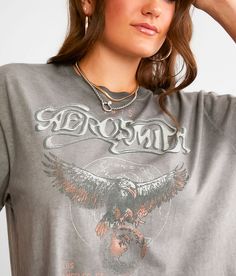 Goodie Two Sleeves Aerosmith Band Fringe T-Shirt - Grey X-Small, Women's Black Distressed graphic washed t-shirt Raw edge details Bust measures 42 on size small Body length 19 on size small. 100% Cotton. Machine wash cold with like colors. Only non-chlorine bleach. Low iron if needed. Do not iron decoration.. Measurements: Bust -Fullest part of bust with arms at sides. Waist -Circumference of natural waist: above belly button below rib cage. Hips -Standing with feet together fullest part of hips