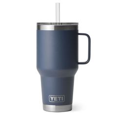 the yeti travel mug is blue and has a straw in it's cup