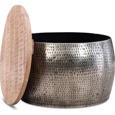 a large metal pot with a wooden lid on the bottom and inside it is sitting next to a white background