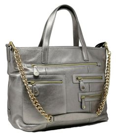 DKNY Silver Leather Large Convertible Chain Strap Crossbody Handbag PurseCondition: New with tags Top Magnetic Closure 4 Functioning Front Zip Pocket Details Interior: 1 zip pocket, 2 slip pockets Removable Strap -- Can be worn as a handbag or crossbody Dimensions: 14.5"L x 12"H x 5"D Comes from a smoke-free, pet-free home! Rectangular Satchel With Metal Hardware For Travel, Modern Bags With Metal Hardware For On-the-go, Tote Hobo Bag With Metal Hardware For Travel, Rectangular Travel Satchel With Metal Hardware, Travel Tote Hobo Bag With Metal Hardware, Travel Hobo Bag With Metal Hardware, Shopping Satchel With Metal Hardware And Crossbody Shape, Satchel With Metal Hardware For Shopping, Top Handle Bags With Metal Hardware For Everyday