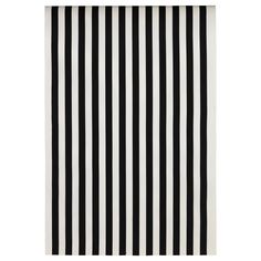 a black and white rug with vertical stripes