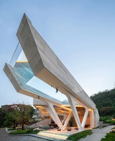 a modern house with an unusual roof design