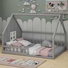 a child's room with a bed, rug and wall hangings on the walls