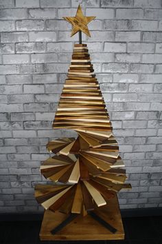 a wooden christmas tree made out of books