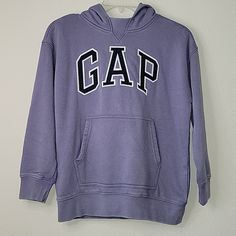 Gap Teen Arch Hood Sweatshirt, Nwt Size:8/M (8-9 Years Old)/130cm Color:Purple Casually Cool Retro Style Pullover Hoodie Gap Arch Logo Applique At Front Soft & Cozy Fleece Knit Pullover Style Measurements: Pit To Pit:20" Length:22.5" Sleeve Length:17" Product Features Double Layered Hood Long Sleeves 1-Pocket/ Kangaroo Pocket + 1 Hidden Pocket Ribbed Cuffs And Hem Fabric & Care 77% Cotton, 23% Polyester Machine Wash Smoke-Free And Pet Free Shipping The Next Day Gap Cotton Crew Neck Hoodie, Gap Cotton Hooded Top, Gap Winter Tops With Letter Print, Gap Tops With Letter Print For Winter, Gap Letter Print Tops For Winter, Gap Long Sleeve Top With Letter Print, Sporty Gap Tops For Winter, Turtleneck And Sweatshirt, Toddler Boy Hoodie