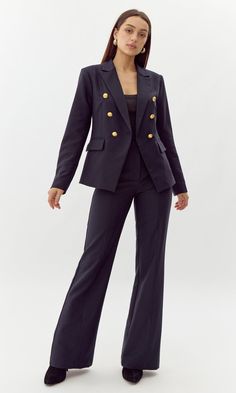 This bold blazer is adorned with gold buttons on the bodice and sleeves. The double-breasted structure also features faux, front pockets and a notched lapel. Can be matched with Colson Trousers. Blazer Double-Breasted Lined Length: 26" Chest: 17 1/4" Self: 77% Polyester, 16% Viscose, 7% Spandex Lining: 97% Polyester, 3% Spandex Hand wash in cold water with similar colors. Model is wearing a size small Style #: G247J1755 Formal Double Breasted Suit With Button Cuffs For Fall, Classic Formal Blazer Dress With Gold Buttons, Classic Blazer Dress With Gold Buttons For Formal Occasions, Business Blazer With Gold Buttons, Long Sleeve, Chic Formal Blazer With Gold Buttons, Business Pantsuit With Suit Collar And Buttons, Long Sleeve Blazer With Gold Buttons For Work, Double-breasted Business Blazer Dress With Button Cuffs, Double-breasted Blazer Dress For Business Casual