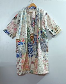 "Indian handmade patch work Block Printed Kantha Kimono , Hand Block Kantha Quilted Kimono Robe , Indian Beach Wear , Nightwear Kimono , Bath Robe , Made Of Cotton Kantha, Quilted Kimono Color : As Per Image Length:30= 40\"=50= Inches *Shoulder: 8\" Inches *Sleeve Length: 14\" Inches *Sleeve hole: 9\" Inches *2 Side Pockets Pattern :- Printed Handmade... For the very reason that each item has been handmade there is always an element of human error, whether it be a missed stitch or overlapping bl Multicolor Bohemian Kimono For Home, White Bohemian Kimono For Home, Vintage Multicolor Patchwork Kimono, Multicolor Cotton Kimono With Floral Embroidery, Cotton Kimono With Patchwork And Kimono Sleeves, Multicolor Embroidered Cotton Kimono, Embroidered Multicolor Cotton Kimono, Multicolor Kimono With Floral Embroidery, Traditional Patchwork Kimono For The Beach