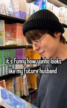 a young man reading a book in front of bookshelves with the caption it's funny how ynho looks like my future husband