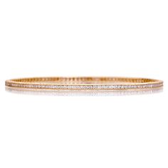 Achieve simple elegance with the Channel White Diamond Bangle. Milgrain finish with signature engraving featured on the sides. 18K Yellow Gold 127 Brilliant-Cut White Diamonds Total Diamond Weight: 2.5cts Bangle Width: 2mm Bangle Opening: 2.5" Classic Channel Set Diamond Bracelet For Wedding, Classic Wedding Bangle With Vvs Clarity, Luxury Tennis Bracelet With Channel Set For Formal Occasions, Luxury Channel Set Tennis Bracelet For Formal Occasions, Classic Diamond Cut Bangle Bracelets, Classic Yellow Gold Bracelet With Channel Set, Classic Channel Set Diamond Bracelet, Classic Yellow Gold Bracelet Channel Set, Timeless Channel Set Bracelets For Wedding