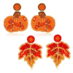 three pairs of orange beaded earrings with pumpkins and leaves on the ear ends