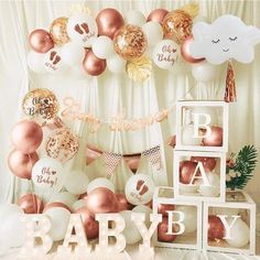 a baby shower party with balloons and decorations