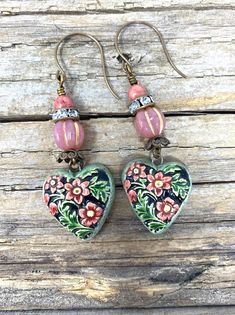 These little ones are cute and colorful.  These handmade ceramics have a green leaf background  with pink flowers. I have added brass bead caps, Czech glass beads and rhinestone rondelles. Green Leaf Background, Earrings Ceramic, Ceramic Earrings, Gilbert Az, Ceramic Earring, Earring Ideas, Leaf Background, Green Leaf, Bead Caps