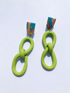 Handmade polymer clay earrings with tan, orange and blue swirled posts and lime green infinity knots. By Amanda Carmona *If choosing an alternate color please include a note with description. Infinity Knot, Knot Earrings, Vibrant Orange, Acrylic Earrings, Lime Green, Polymer Clay Earrings, Clay Earrings, Vintage Ladies