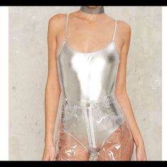 Nwt Brashy Studios Mp3 Metallic Swimsuit/Bodysuit Is Sooo Shiny And Beautiful! It's Sold Out At Nasty Gal And Everywhere Else I've Seen! Fits True To Size. It Has A Silver-Tone Shell With A Flattering Scoop Neck And Low Back. Would Look Perfect With The Brashy Windbreaker In My Closet! Never Been Worn And Still Has Hygienic Liner And Tags. Summer Club Bodysuit With Lined Body, Metallic Swimwear For Summer, High Waist Bodysuit For Club In Summer, Metallic Fitted Bodysuit For Summer, Metallic Sleeveless Bodysuit For Summer, Metallic Swimsuit For Beach In Summer, Summer Metallic Sleeveless Bodysuit, Trendy Club Bodysuit With Lined Body, Metallic Swimwear For Club In Summer