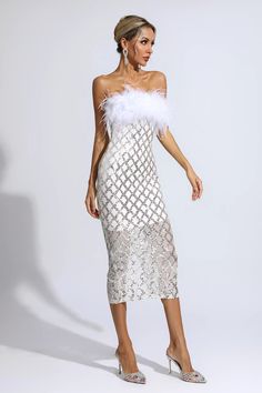 This Kayleigh White Feather Sequin Midi Dress will make you sexy! The bandeau top is made from soft, cozy feather fabric and the skirt is trimmed with mesh sequins. It's perfect for lively gatherings. Under the light, the dress shone brightly. With a pair of high heels, you are a sexy goddess!  Dress Length: Approx 116cm Materials: Polyester Gentle Dry Clean Only  Model is 5 ft 7 and wears size S  Colour may vary due to lighting on images. The product images (without model) are closest to the tr Feather Fabric, Silver Sequin Top, Glitter Wedding Dress, Calf Length Dress, Sequin Midi Dress, Bandage Midi Dress, Goddess Dress, White Feather, Feather Trim