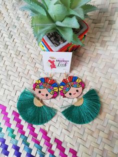 Hand painted wooden craft earrings, floral earrings, traditional Mexican earrings. Accessories decorated by hand with the Chiapa de Corzo technique. The technique of Chiapa de Corzo consists; First the use of the little finger to paint,and the second is the design; based on flowers, predominantly roses, birds and forage with fern-like leaves. All our accessories are hand painted with natural pigments and linseed oil, sealed with artisan lacquer they are very light to use in all occasions Each ac Traditional Green Handmade Earrings, Traditional Handmade Green Earrings, Traditional Handmade Tassel Earrings As Gift, Handmade Green Tassel Earrings For Gift, Artistic Hand Painted Festival Earrings, Handmade Green Tassel Earrings For Festival, Otomi Earrings, Bohemian Multicolor Hand Painted Flower Earrings, Traditional Hand Painted Dangle Earrings