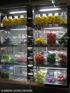 a display case filled with lots of fruits and vegetables