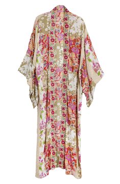 Hit the beach or kick it poolside in this flowy kaftan that features an allover floral pattern, kimono-inspired sleeves and an uneven hem. Kimono-inspired sleeves 100% rayon Hand wash, line dry Imported Bohemian Floral Print Robe For Vacation, Bohemian Robe With Floral Print For Vacation, Long Beachwear Kimono With Boho Print, Multicolor Print Kimono For Spring Beach Cover-up, Long Boho Print Kimono For Beachwear, Patterned Long Sleeve Kimono For Beach, Long Patterned Floral Print Kimono, Long Sleeve Patterned Kimono For Beach, Spring Bohemian Kaftan With Kimono Sleeves