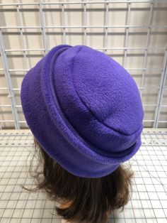 I made this warm pillbox style hat out of purple plum fleece for warmth and comfort. The stand and top are a double layer of fleece. It's sized to fit most adults 21.5-23 inches around head. It has a nice stretchy feel and is completely machine washable and dryable. Purple Felt Hat With Short Brim For Winter, Purple Short Brim Felt Hat For Winter, Winter Purple Felt Hat With Short Brim, Purple Brimmed Felt Hat For Winter, Fleece Hat Pattern, Fleece Sewing Projects, Sewing Hats, Fleece Hats, Purple Fleece