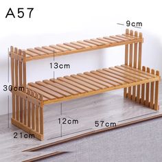 a wooden bench with measurements for it to be placed on the floor in front of a wall