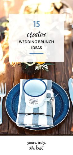 a blue and white dinner plate with silverware on it, next to a vase filled with flowers