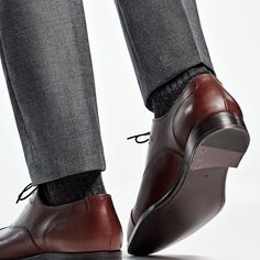 These classic brown Oxfords are crafted from supple calf leather in a flexible Blake stitch, and feature full leather lining and sole. Classic Round Toe Dress Shoes For Fall, Fall Calf Leather Shoes With Leather Footbed, Brown Goodyear Welted Cap Toe Dress Shoes, Leather Cap Toe Oxfords For Fall, Business Leather Shoes With Round Toe And Leather Footbed, Classic Tailored Dress Shoes With Leather Sole, Business Leather Shoes With Leather Footbed And Round Toe, Leather Shoes With Leather Sole For Fall, Fitted Leather Oxfords For Business Casual