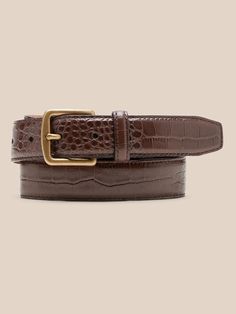 Sleek and streamlined, this embossed leather belt adds a bit of variety to your wardrobe.  LEATHER WORKING GROUP: By purchasing this product, you are supporting responsible leather manufacturing through the Leather Working Group.  Width: 1" (2. 5cm) Elegant Formal Belt Buckles With Crocodile Pattern, Elegant Formal Belt Buckle With Crocodile Pattern, Classic Business Belt With Crocodile Pattern, Classic Crocodile Pattern Belts For Business, Classic Crocodile Pattern Business Belts, Luxury Business Belt With Crocodile Pattern, Luxury Crocodile Pattern Belt For Business, Luxury Leather Belt Buckles With Crocodile Pattern, Luxury Leather Belt With Crocodile Pattern