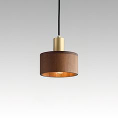 a wooden light fixture hanging from a ceiling