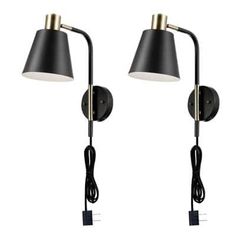 two black and gold wall lights with one light on each side, the other turned off