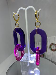 Purple and pink lightweight resin, fun, earrings with gold findings. Trendy Pink Resin Jewelry, Trendy Purple Plastic Jewelry, Trendy Pink Plastic Jewelry, Pink Plastic Drop Earrings, Trendy Pink Plastic Earrings, Bold Pink Jewelry For Gifts, Pink Plastic Earrings For Party, Pink Plastic Party Earrings, Bold Pink Earrings For Party