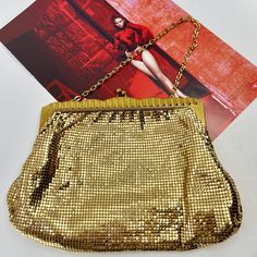 This Whiting & Davis branded handbag is in lovely vintage condition.  All mesh tiles are in tact and none are missing.  No tarnish.  The frame is also in excellent condition with no major scratches and no colour fade.  The same for the inside.  Clean and no stains at all.  Bag looks like it wasnt used and is overall in fabulous condition.  The bag is stamped Whiting and Davis and is style 2932.  Likely from the 60s by the style.    Bag is a great size and is a little larger than others.  Size me Vintage Rectangular Evening Bag For Party, Vintage Gold Shoulder Bag For Party, Retro Gold Bags With Gold-tone Hardware, Gold Retro Bags With Gold-tone Hardware, Retro Gold Rectangular Evening Bag, Gold Retro Bags, Gold Rectangular Evening Bag For Vintage Events, Vintage Gold Shoulder Bag With Gold-tone Hardware, Retro Gold Rectangular Shoulder Bag