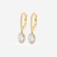 Set an image of sophistication with these stylish oval shaped lab grown diamond drop earrings. With a delicate halo of round diamonds surrounding it, and a diamond encrusted lever back, these earrings delicately dangle from the ears. Round Halo, Diamond Dangle Earrings, Diamond Drops, Pear Shaped Diamond, Perfect Engagement Ring, Gold Drop Earrings, Diamond Halo, Diamond Drop Earrings, Conflict Free Diamonds