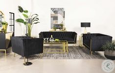 a living room filled with black couches and gold tables next to potted plants