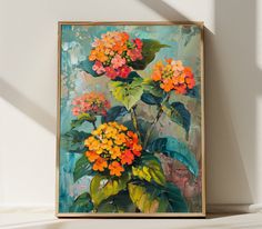 an oil painting of orange and yellow flowers on a white wall with sunlight coming through the window