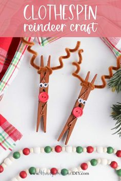 two reindeer puppets made out of paper on top of a table with candy and christmas decorations