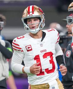 a close up of a football player wearing a helmet