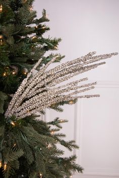 a close up of a christmas tree with lights