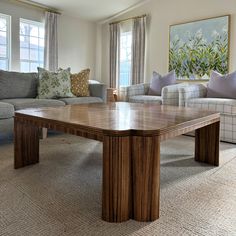 a living room with couches and a coffee table in it's center area