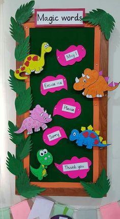 a bulletin board with dinosaur magnets on it