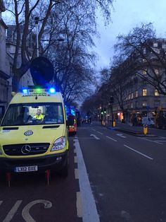 an ambulance is parked on the side of the road