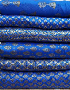 "Width : 50\" Length: 36\" Fabric Type: Art Silk Brocade These are beautiful Banarasi blended silk brocade Indian Vintage design fabric . The fabric illustrate Silk thread weaves with gold Metallic thread. Creating Beautiful texture of design figure. This fabrics are reversible you can use either side of the fabric depends on your choice. Silk Brocade Fabric by the Yard, Banarasi Silk Brocade Fabric, Banaras Brocade Blended Silk Fabric for Wedding Dress fabric, lehenga Skirt fabric You can use t Luxury Embroidered Banarasi Silk Fabric With Traditional Patterns, Indian Material Fabrics, Blue Traditional Katan Silk Wear With Motifs, Blue Traditional Wear With Motifs In Katan Silk, Blue Katan Silk Traditional Wear With Motifs, Indian Textile Patterns, Indian Fabrics, Blue Embroidered Saree With Traditional Patterns, Blue Embroidered Fabric With Traditional Patterns For Festive Occasions