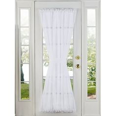 a white curtain hanging on the side of a door