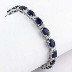 Introducing our Blue Sapphire Tennis Small Oval Silver Bracelet - a perfect blend of elegance and style. This exquisite piece of jewelry is handcrafted with utmost precision, making it a unique addition to your collection or a thoughtful gift for your loved ones. Key Features Handmade Jewelry: Each bracelet is meticulously handcrafted, ensuring a level of detail and quality that is truly unparalleled. 925 Sterling Silver: Made with 925 Sterling Silver, this bracelet offers durability and longevi Formal Sapphire Oval Bracelets, Formal Sapphire Oval Bracelet, Elegant Sterling Silver Bracelet With Sapphire, Silver Oval Sapphire Tennis Bracelet, Elegant Sterling Silver Sapphire Bracelet, Luxury Sapphire Oval Bracelets, Elegant Sapphire Sterling Silver Bracelet As Gift, Elegant Sapphire Sterling Silver Bracelet, Elegant Sterling Silver Bracelet With Oval Gemstone