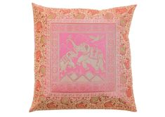 a pink and gold pillow with an elephant on it